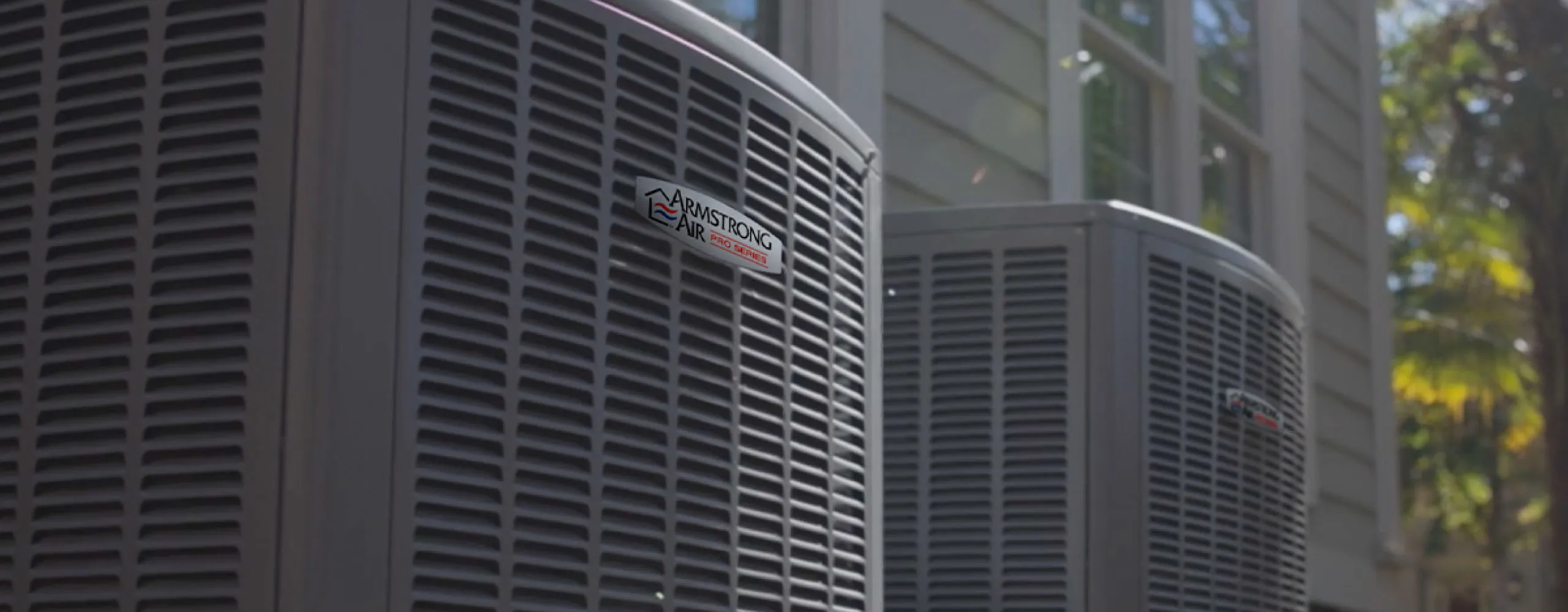 AccuMax technicians servicing a heat pump system at an Aurora, IL home