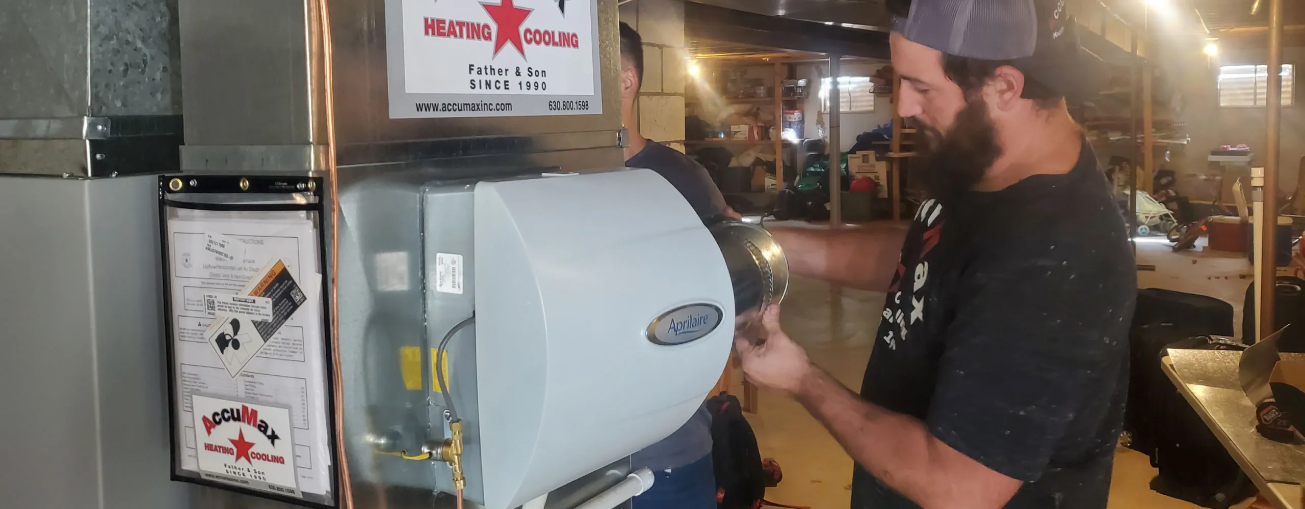 AccuMax technicians installing an indoor air quality system at an Aurora, IL home