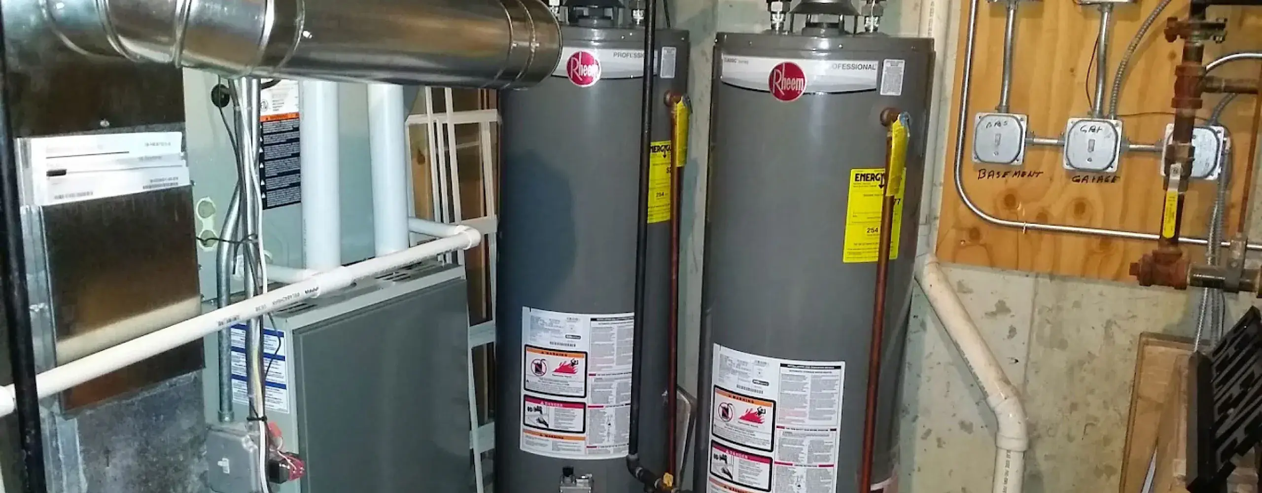AccuMax technician servicing a tank water heater at an Aurora, IL home