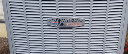 Newly installed Armstrong Air Pro Series air conditioner condenser outside an Aurora, IL home