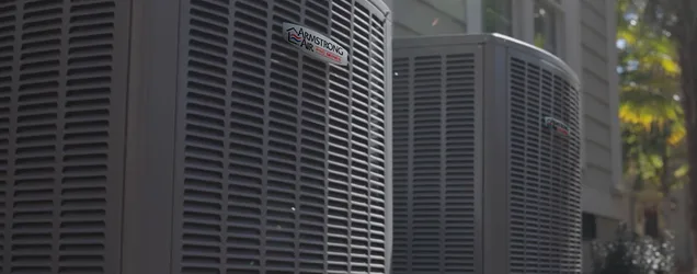 Armstrong Air heat pump outdoor unit installed beside an Illinois home